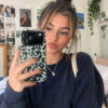 Mint green leopard print phone case shown in a lifestyle mirror selfie